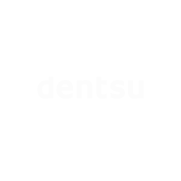 Das Bild zeigt das Wort dentsu in schlichten weißen Kleinbuchstaben, zentriert auf einem hellgrauen Hintergrund.